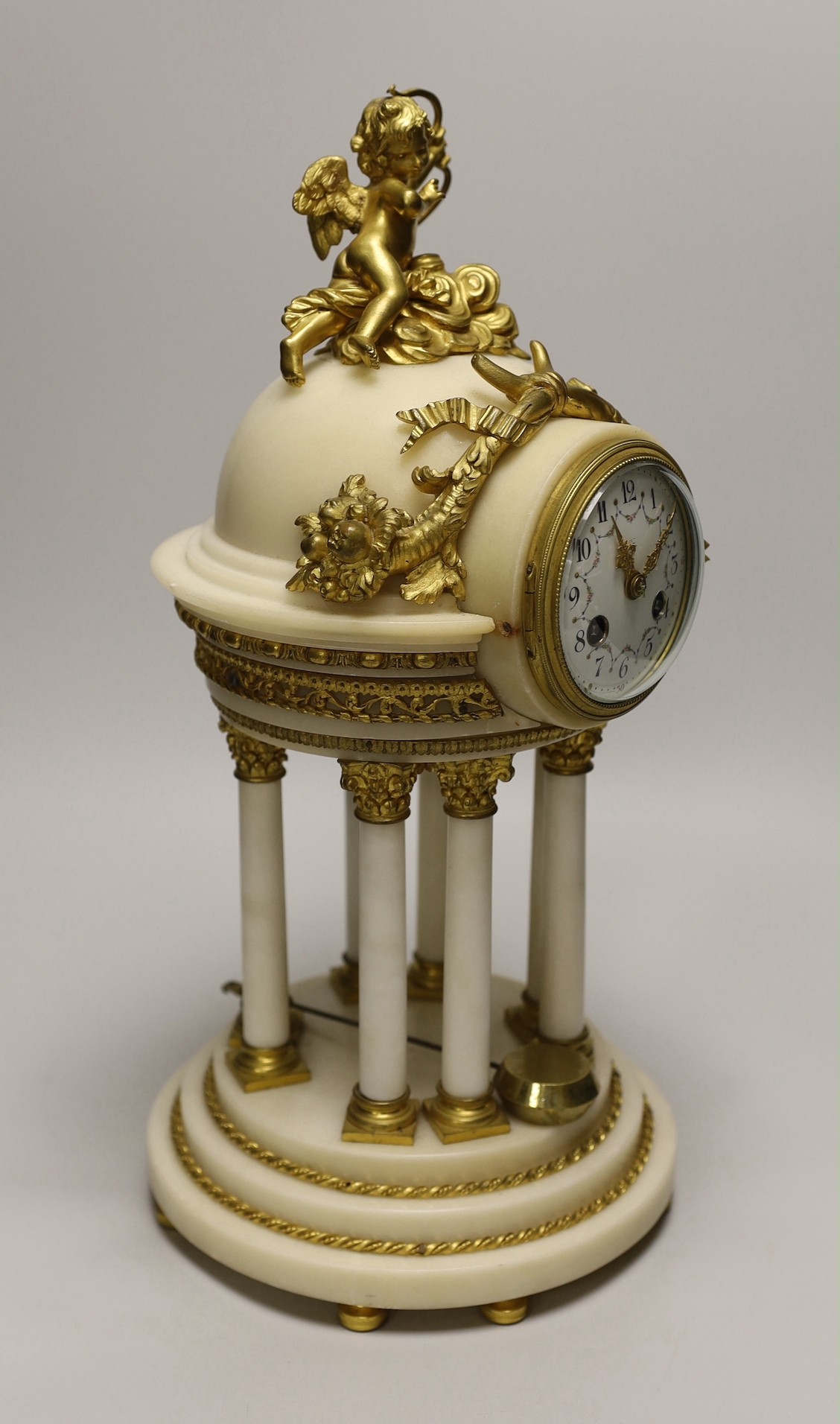 An early 20th century French alabaster and ormolu mantel ‘cupola’ clock with pendulum, 39cm tall